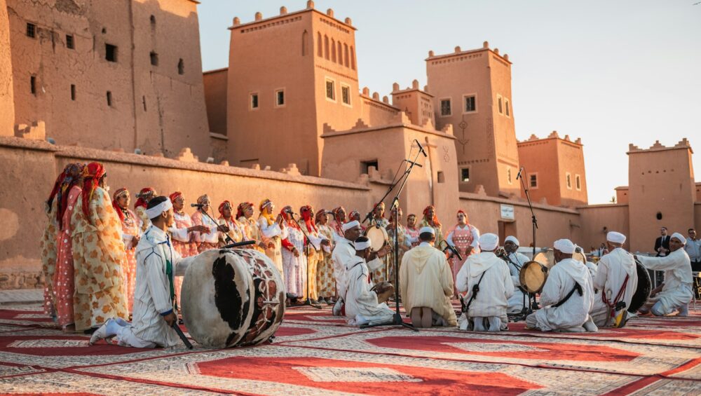 a group of people standing on top of a rug