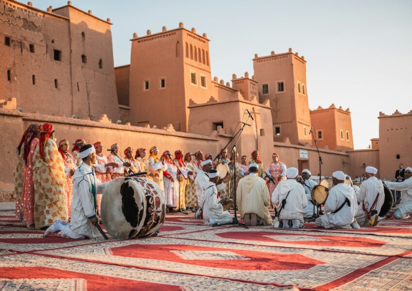 a group of people standing on top of a rug